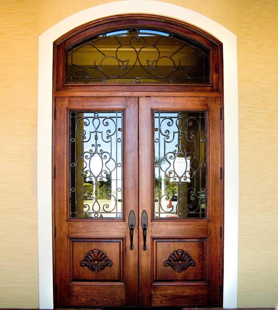 Elliptical-top wood and iron entry door